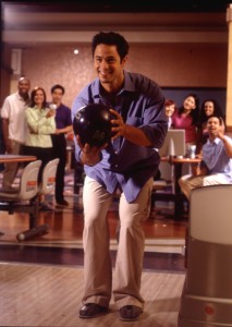 Younger male in bowling ready position